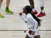 Louisville guard Dana Evans (1) celebrates a score against the Oregon during the first half of a college basketball game in the Sweet Sixteen round of the women&#039;s NCAA tournament at the Alamodome in San Antonio, Sunday, March 28, 2021.