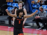 Oregon State guard Ethan Thompson (5) reacts to a basket against Tennessee during the second half of a men&#039;s college basketball game in the first round of the NCAA tournament at Bankers Life Fieldhouse in Indianapolis, Friday, March 19, 2021.