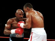 &quot;Marvelous&quot; Marvin Hagler, left, moves in on &quot;Sugar&quot; Ray Leonard during their bout in 1987. Hagler, the middleweight boxing great whose title reign and career ended with the loss to Leonard in 1987, died Saturday, March 13, 2021. He was 66.