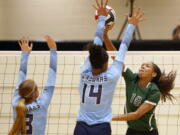 FILE - Reagan&#039;s Kyla Waiters, right, spikes the ball past Johnson defenders during a Texas District 26-6A high school volleyball match in San Antonio, Texas, in this Friday, Sept. 22, 2017, file photo. Oregon State leaders are suing to block disclosure of details about an investigation of abuse allegations in their volleyball program, even as they tout a refreshed mission for transparency in wake of their president&#039;s resignation over the handling of sexual-misconduct cases at another school. &quot;I&#039;m guessing there&#039;s something in those records that they don&#039;t want out,&quot; said Dorina Waiters, whose daughter, Kyla, left Oregon State after a year on the volleyball team triggered depression that led to suicidal thoughts.