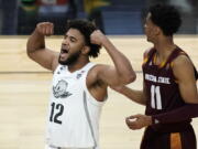 Oregon&#039;s LJ Figueroa (12) celebrates after a play against Arizona State during the second half of an NCAA college basketball game in the quarterfinal round of the Pac-12 men&#039;s tournament Thursday, March 11, 2021, in Las Vegas.