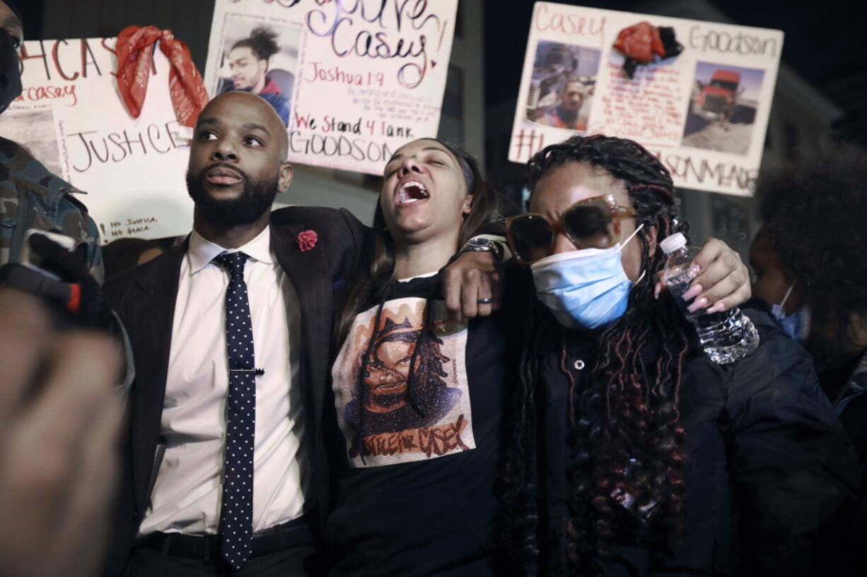 FILE - In this Dec. 11, 2020 file photo, Tamala Payne, center, with attorney Sean Walton, participates in a protest march against the shooting of her son, Casey Goodson Jr. in Columbus, Ohio. The final coroner&#039;s report released Thursday, March 18, 2021, indicated Goodson was shot five times in the back by a white Ohio sheriff&#039;s deputy last December. Relatives of the victim have said he was shot while opening the door at his grandmother&#039;s house.