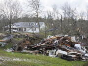 Debris litters weather-damaged properties at the intersection of County Road 24 and 37 in Clanton, Ala., the morning following a large outbreak of severe storms across the southeast, Thursday, March 18, 2021.