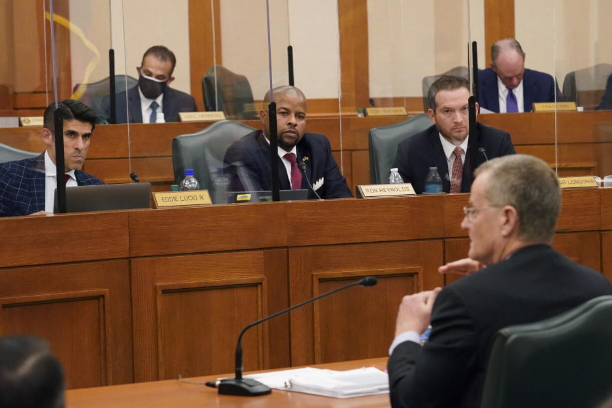 FILE - In this Feb. 25, 2021 file photo, lawmakers listen as Bill Magness, President and CEO of the Electric Reliability Council of Texas (ERCOT), testifies as the Committees on State Affairs and Energy Resources hold a joint public hearing to consider the factors that led to statewide electrical blackouts, in Austin, Texas. Power plants in Texas that froze up during February&#039;s winter storm that killed more than 100 people would face new weatherization mandates under legislation advancing closer to Gov. Greg Abbott&#039;s desk Tuesday, March 30, 2021.