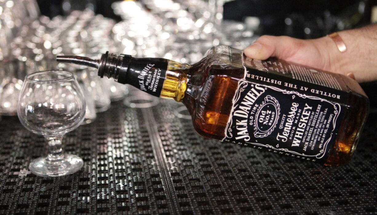 FILE - In this March 4, 2011, file photo, a bartender begins to pour a drink from a bottle of Jack Daniels at a bar in San Francisco.  Bourbon, Tennessee whiskey and rye whiskey were left out of a recent breakthrough to start rebuilding trade relations between the U.S. and European Union in the wake of Donald Trump&#039;s presidency. While tariffs were suspended on some spirits, the EU&#039;s 25% tariff on American whiskey remains in place, and the rate is set to double to 50% in June in the industry&#039;s largest export market.