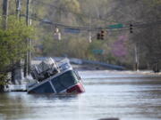 A Nashville Fire Department truck is revealed as flood waters from the Harpeth River recede Monday, March 29, 2021, in Nashville, Tenn. Recent storms dropped seven inches of rain in the area that resulted in flooding and flash flooding across the city.