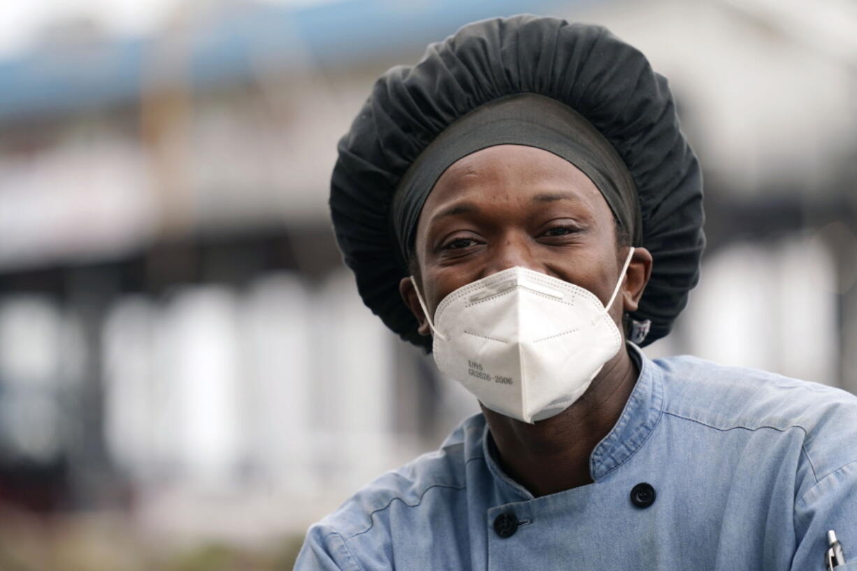 Leo Carney, kitchen manager at McElroy&#039;s Harbor House in Biloxi on the Mississippi Gulf Coast, said the removal of coronavirus restrictions will disproportionately impact Black residents -- many of whom are essential workers, Friday, March 5, 2021. Carney said he would feel better with restrictions being removed if essential workers had access to the coronavirus vaccine. (AP Photo/Rogelio V.