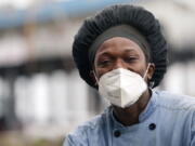 Leo Carney, kitchen manager at McElroy&#039;s Harbor House in Biloxi on the Mississippi Gulf Coast, said the removal of coronavirus restrictions will disproportionately impact Black residents -- many of whom are essential workers, Friday, March 5, 2021. Carney said he would feel better with restrictions being removed if essential workers had access to the coronavirus vaccine. (AP Photo/Rogelio V.