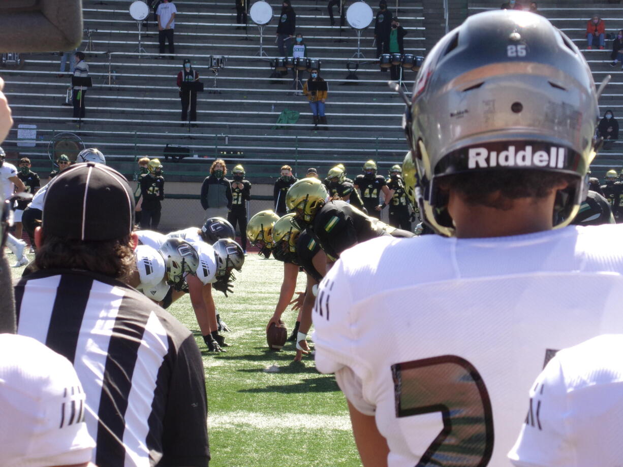 Evergreen and Union prepare for the snap during Union's 48-6 win over the Plainsmen on Saturday, March 27, 2021 (Tim Martinez/The Columbian)