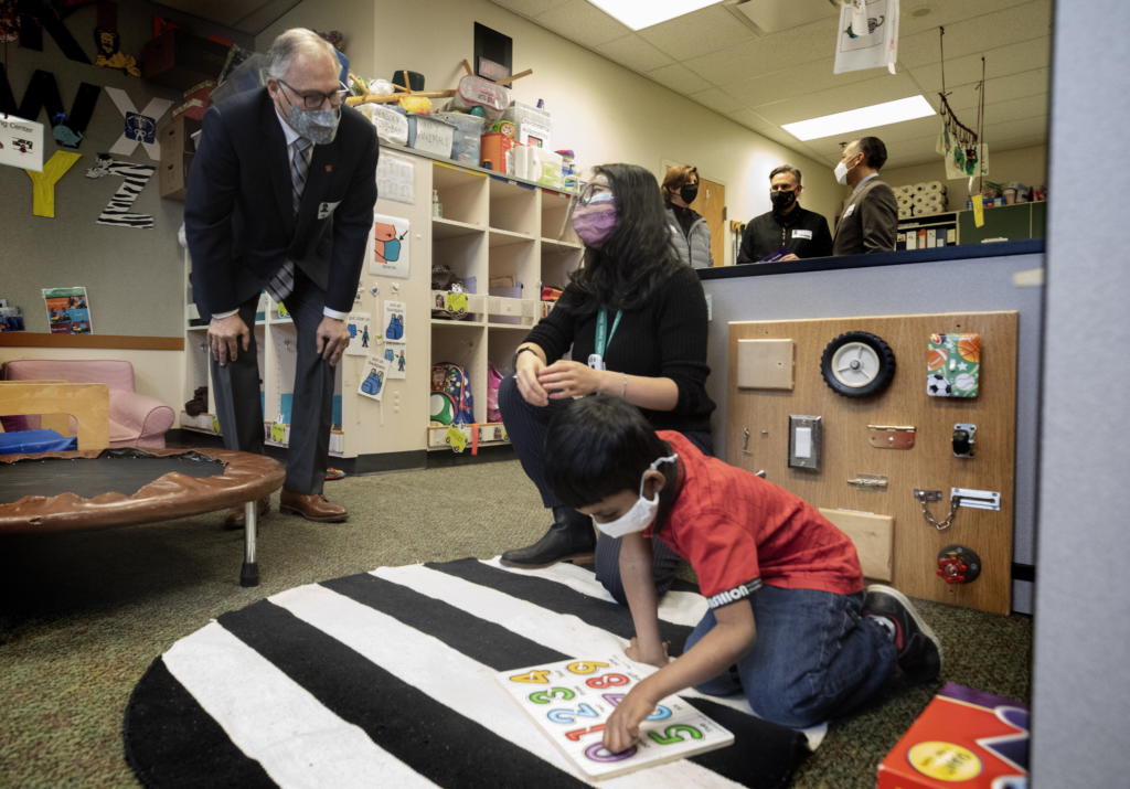 Washington State Governor Jay Inslee speaks with special ed Pre-K teacher Michelle Ling in her classroom at Phantom Lake Elementary School in Bellevue, Wash. Tuesday, March 2, 2021. (Ellen M.