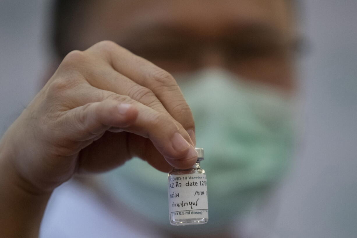 FILE - In this March 12, 2021, file photo, a health worker holds a bottle of AstraZeneca COVID-19 vaccine with name Thailand&#039;s Prime Minister Prayuth Chan-ocha written on it, at Bamrasnaradura Hospital in Bangkok, Thailand. In recent days, countries including Denmark, Ireland and Thailand have temporarily suspended their use of AstraZeneca&#039;s coronavirus vaccine after reports that some people who got a dose developed blood clots, even though there&#039;s no evidence that the shot was responsible. The European Medicines Agency and the World Health Organization say the data available do not suggest the vaccine caused the clots.