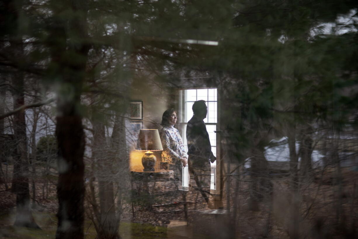 L. Shapley Bassen, left, talks with her husband, Michael, as they stand for a photo in their home in East Greenwich, R.I., Thursday, March 11, 2021. The road to a COVID-19 shot often leads through a maze of scheduling systems: Some vaccine seekers spend days or weeks trying to book online appointments. Those who get a coveted slot can still be stymied by pages of forms or websites that slow to a crawl and crash. The technological obstacles are familiar to Bassen, a 74-year-old retired English teacher and editor. She lost track of the hours she spent making phone calls and navigating websites to get appointments for herself and her 75-year-old husband, Michael. &quot;A lot of us don&#039;t sleep at night worrying about whether or not we&#039;ll be able to get in,&quot; she said.