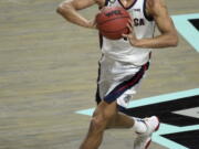 Gonzaga guard Joel Ayayi (11) looks to pass the ball against Saint Mary&#039;s during the first half of an NCAA semifinal college basketball game against Saint Mary&#039;s at the West Coast Conference tournament Monday, March 8, 2021, in Las Vegas.