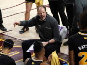 Washington coach Mike Hopkins talks to the team during the first half of an NCAA college basketball game against Arizona State, Tuesday, Feb. 23, 2021, in Tempe, Ariz.