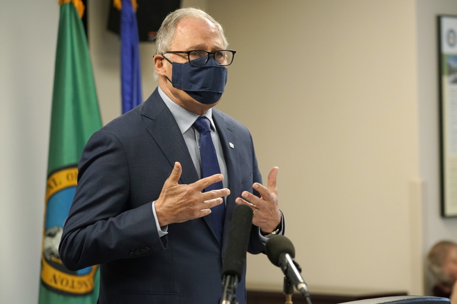 Washington Gov. Jay Inslee speaks Monday, March 22, 2021, at a news conference at Renton City Hall in Renton, Wash., south of Seattle. Inslee and other leaders gathered to denounce recent acts of violence and harassment targeted at Asians and Asian communities. (AP Photo/Ted S.