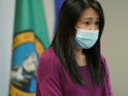 Noriko Nasu, a high school teacher who was attacked earlier in the year while walking through Seattle&#039;s Chinatown-International District, speaks about the possible hate crime Monday, March 22, 2021, at a news conference at Renton City Hall in Renton, Wash., south of Seattle. Nasu joined Washington Gov. Jay Inslee and other leaders Monday to denounce recent acts of violence and harassment targeted at Asians and Asian communities. (AP Photo/Ted S.