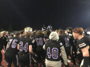 Heritage players celebrate their 30-17 win Friday night at McKenzie Stadium.