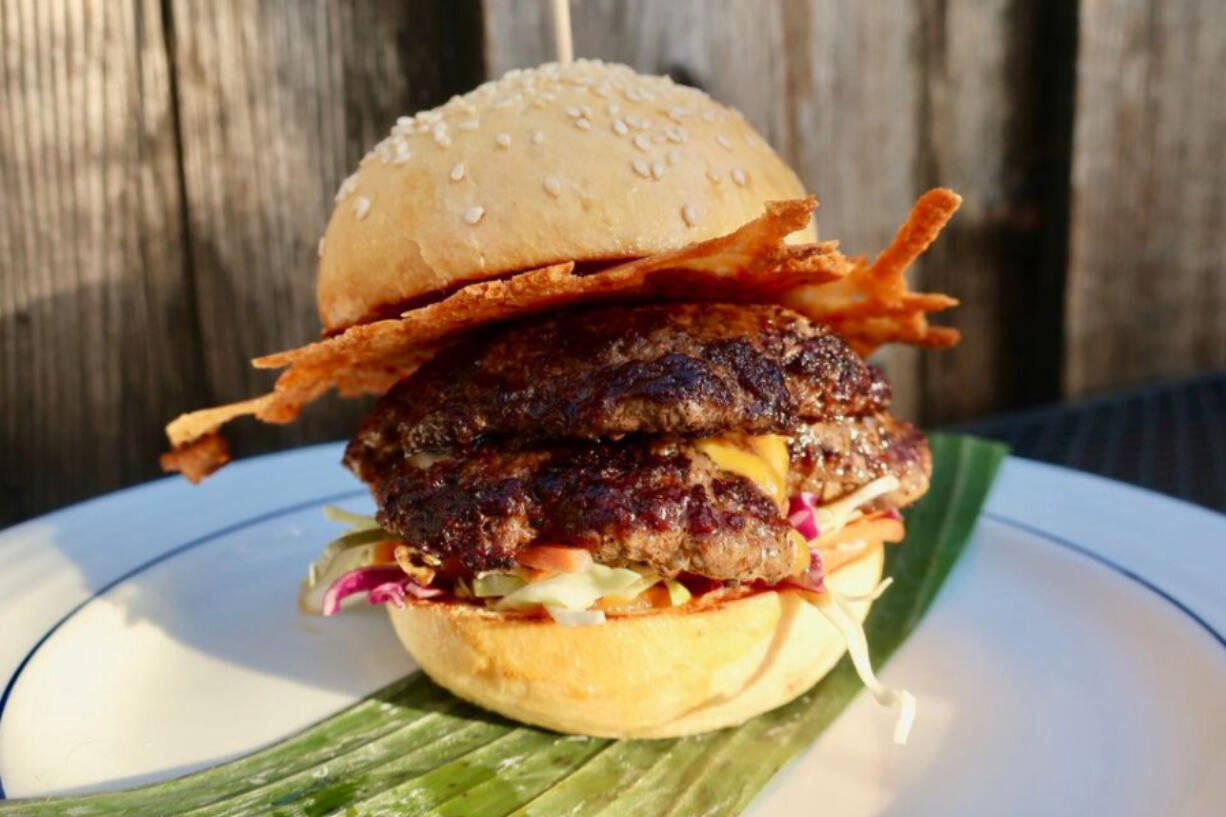 Bit House collective&#039;s double smash burger comes with a fermented habanero and roasted pineapple glaze and a disc of crunchy cheese.