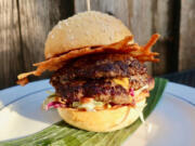 Bit House collective&#039;s double smash burger comes with a fermented habanero and roasted pineapple glaze and a disc of crunchy cheese.