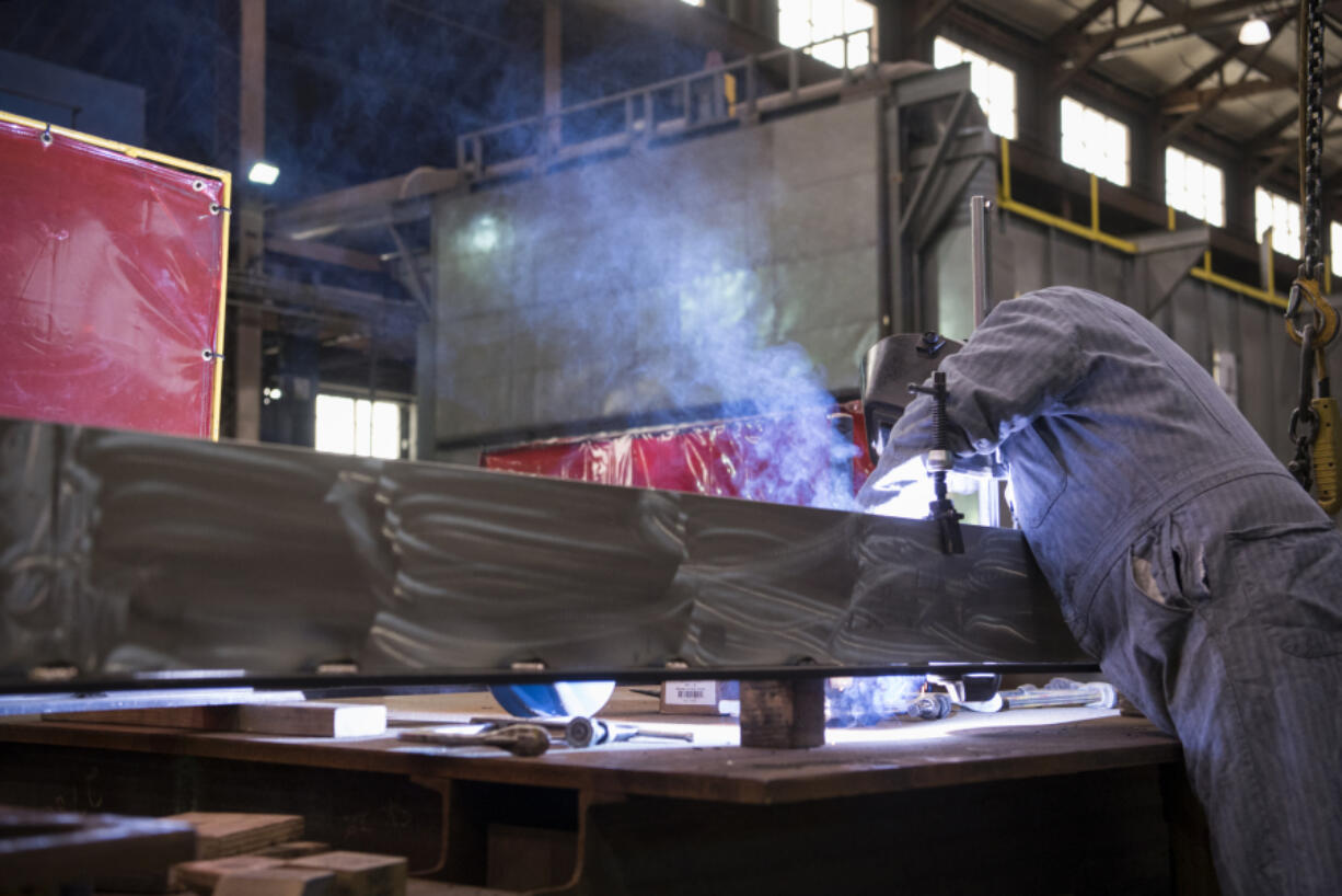 Mechanic Jeremy O&#039;Hearn welds a part at Vigor Industrial in Vancouver in 2019. The Vancouver shipyard is partnering with Clark College on a welding program starting the summer term.