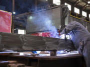 Mechanic Jeremy O&#039;Hearn welds a part at Vigor Industrial in Vancouver in 2019. The Vancouver shipyard is partnering with Clark College on a welding program starting the summer term.