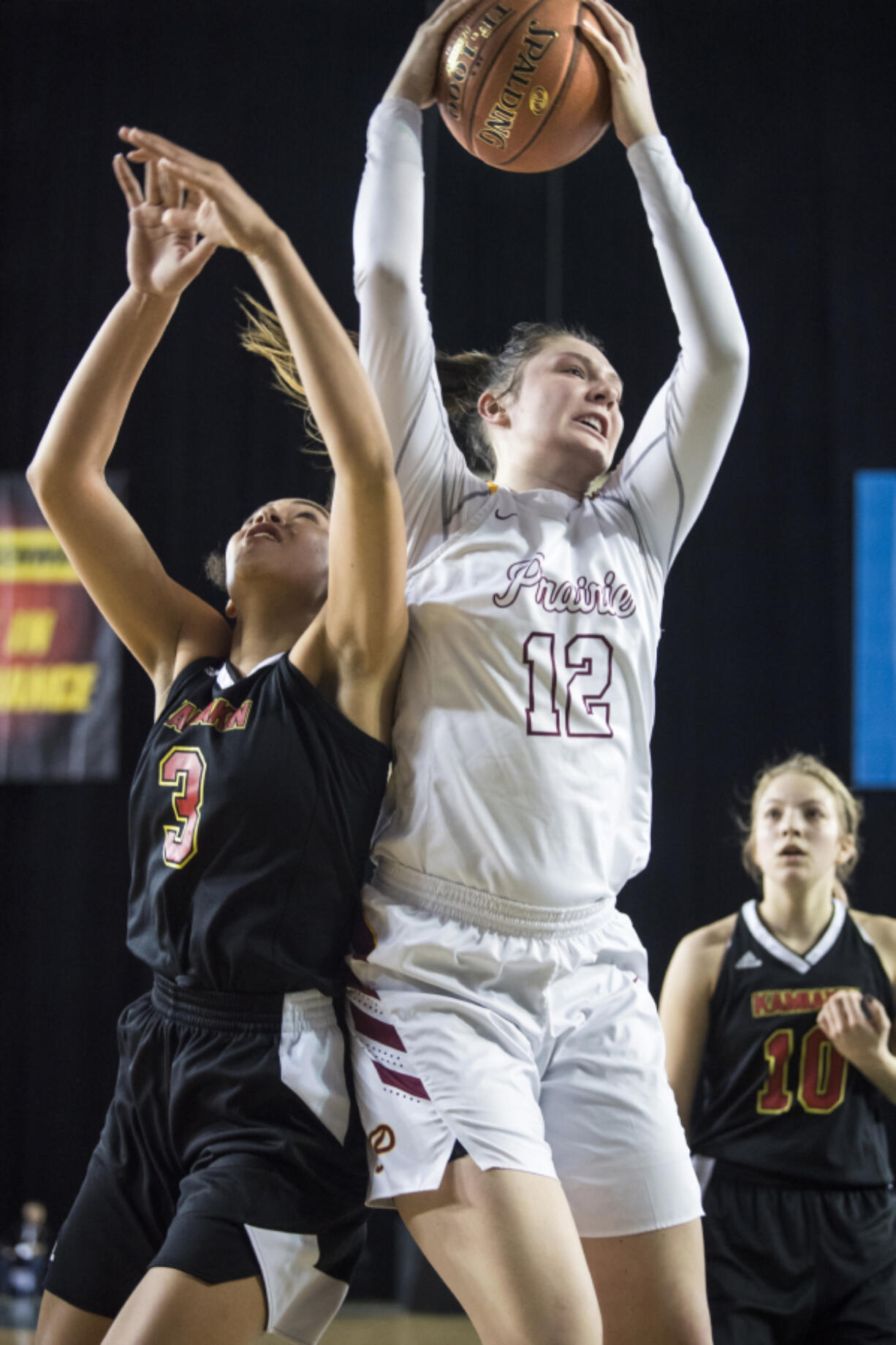 Prairie's Brooke Walling beats Kamiakin's Symone Brown to a rebound during the 3A Hardwood Classic at the Tacoma Dome on Friday March 1, 2019.