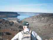 Bob Strong looks out over Banks Lake in March  2020.