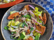 Fattoush is a chopped Levantine salad made with stale pita. This includes shredded chicken tossed in a citrusy tahini-sumac dressing.