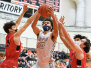 Battle Ground'is Kaden Perry (20) is surrounded by Camas defenders on Friday, April 23, 2021 (Ken Nowaczyk/For The Columbian)