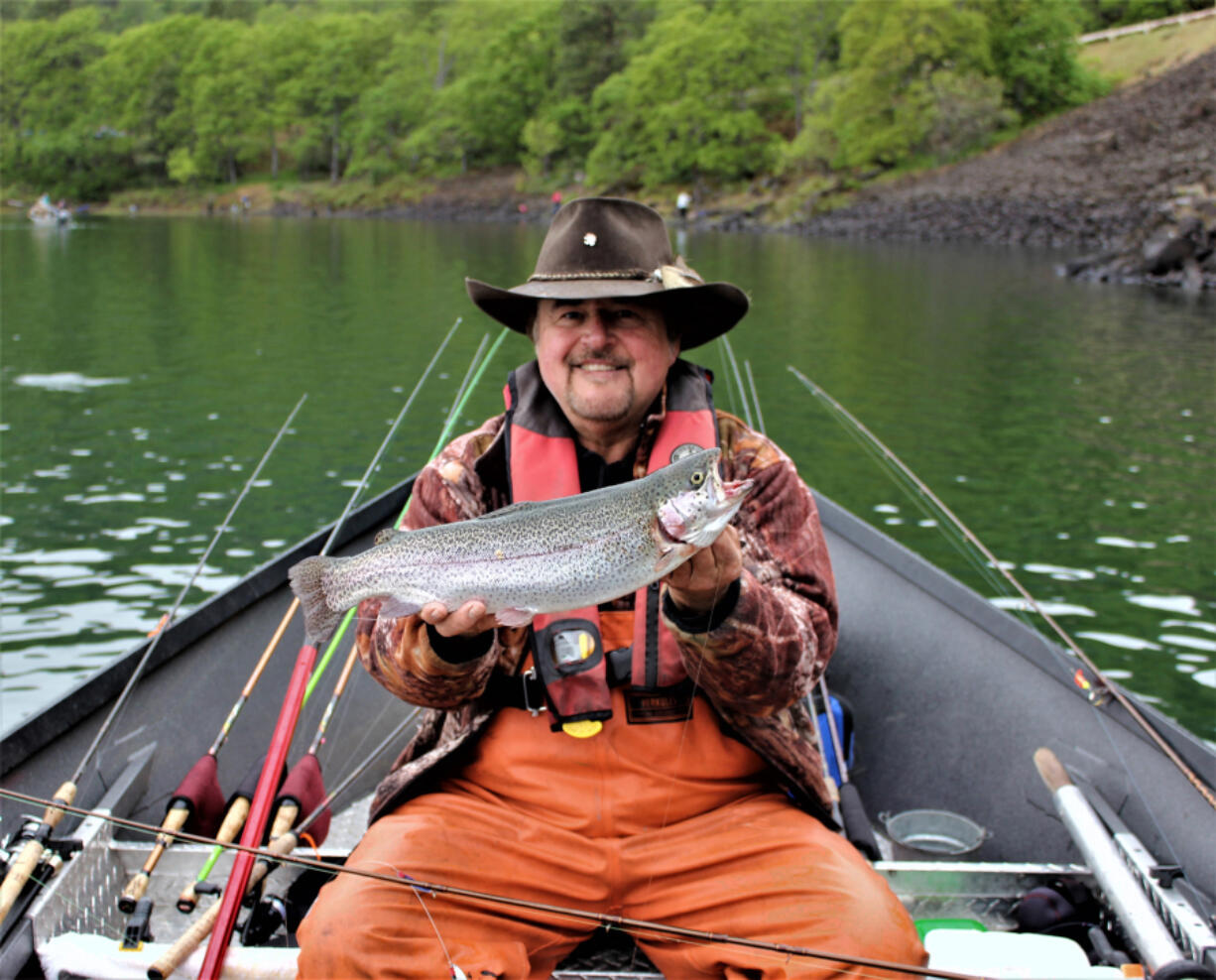 Buzz Ramsey with a brooder rainbow trout he caught while fishing Rowland Lake last Saturday during the spring trout opener. A number of other anglers were also lucky enough to find one of the big boys.