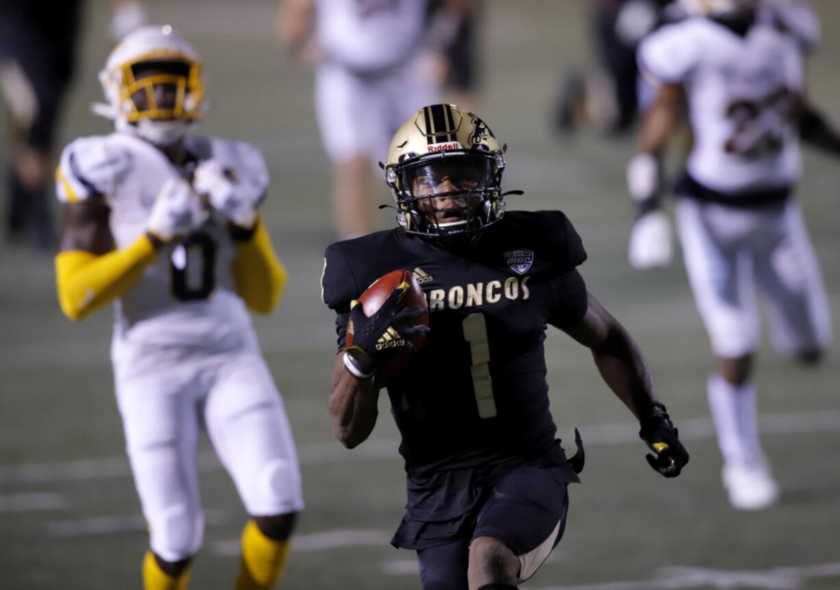 Western Michigan's D'Wayne Eskridge (1) scores a touchdown against Toledo during an NCAA football game on Wednesday, Nov. 11, 2020, in Kalamazoo, Mich. Western Michigan won 41-38.