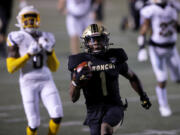 Western Michigan's D'Wayne Eskridge (1) scores a touchdown against Toledo during an NCAA football game on Wednesday, Nov. 11, 2020, in Kalamazoo, Mich. Western Michigan won 41-38.