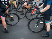 Cyclists take a break from the 2019 Ride Around Clark County event at a Ridgefield fire station. The ride will be back this year in modified form, organizers with the Vancouver Bicycle Club say.