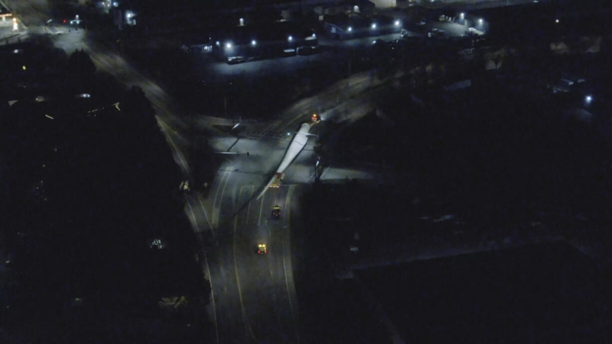 Aerial photos taken by a drone follow the progress of a wind turbine blade as it leaves the Port of Vancouver in the early morning hours of April 1. Wind energy components imported at the port are typically trucked farther inland using Interstate 84 through the Columbia River Gorge.