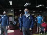 Francisco Bueno, executive director of the Boys &amp; Girls Clubs of Southwest Washington, joins Gov. Jay Inslee during a tour of the Teen Turf club Friday afternoon. Inslee&#039;s visit also included stops at Eleanor Roosevelt Elementary School and the Tower Mall vaccination site.