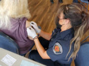 CLARK COUNTY: Members of the Vancouver Fire Department are helping at various sites with the COVID-19 vaccine rollout.