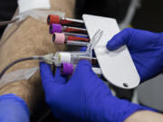 Blood is collected by the American Red Cross during a blood drive at Paul Davis Restoration of Portland/Vancouver in Vancouver in April.