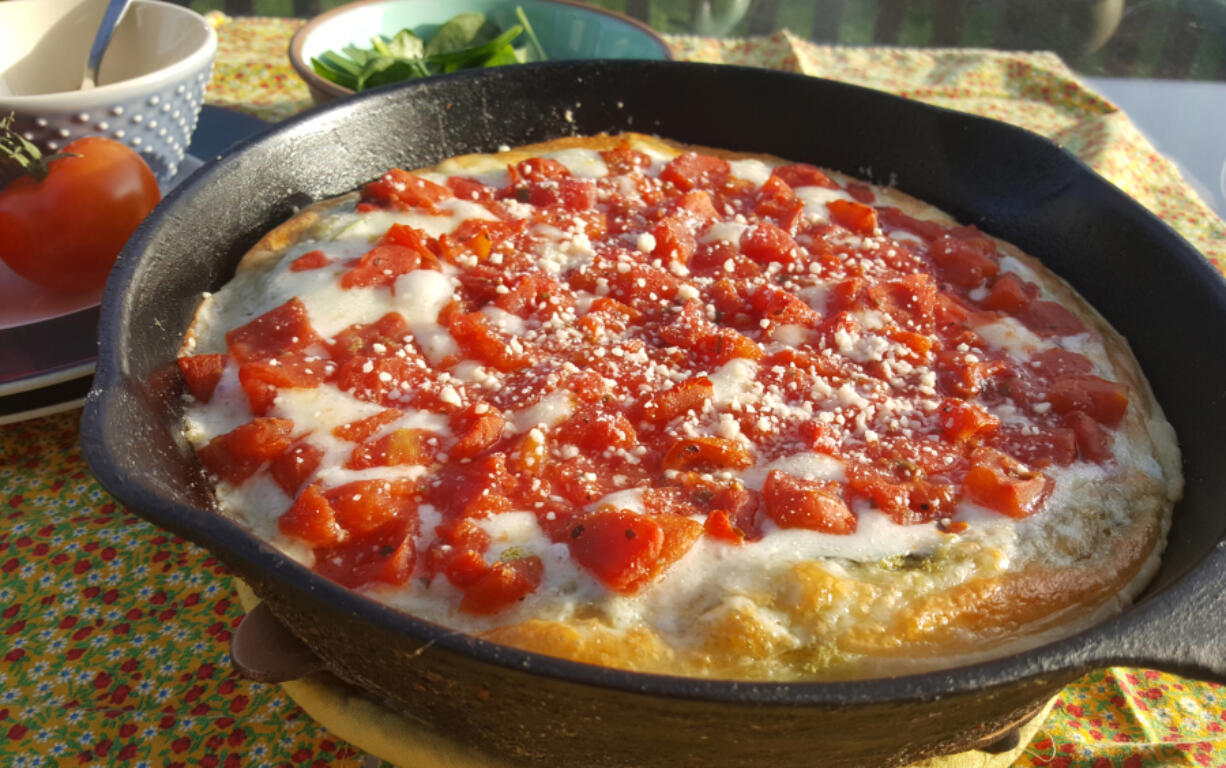 This is the most beautiful pizza right out of the oven, with golden edges, gooey cheese and bright red tomatoes.