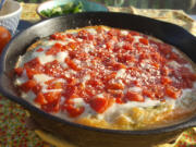 This is the most beautiful pizza right out of the oven, with golden edges, gooey cheese and bright red tomatoes.