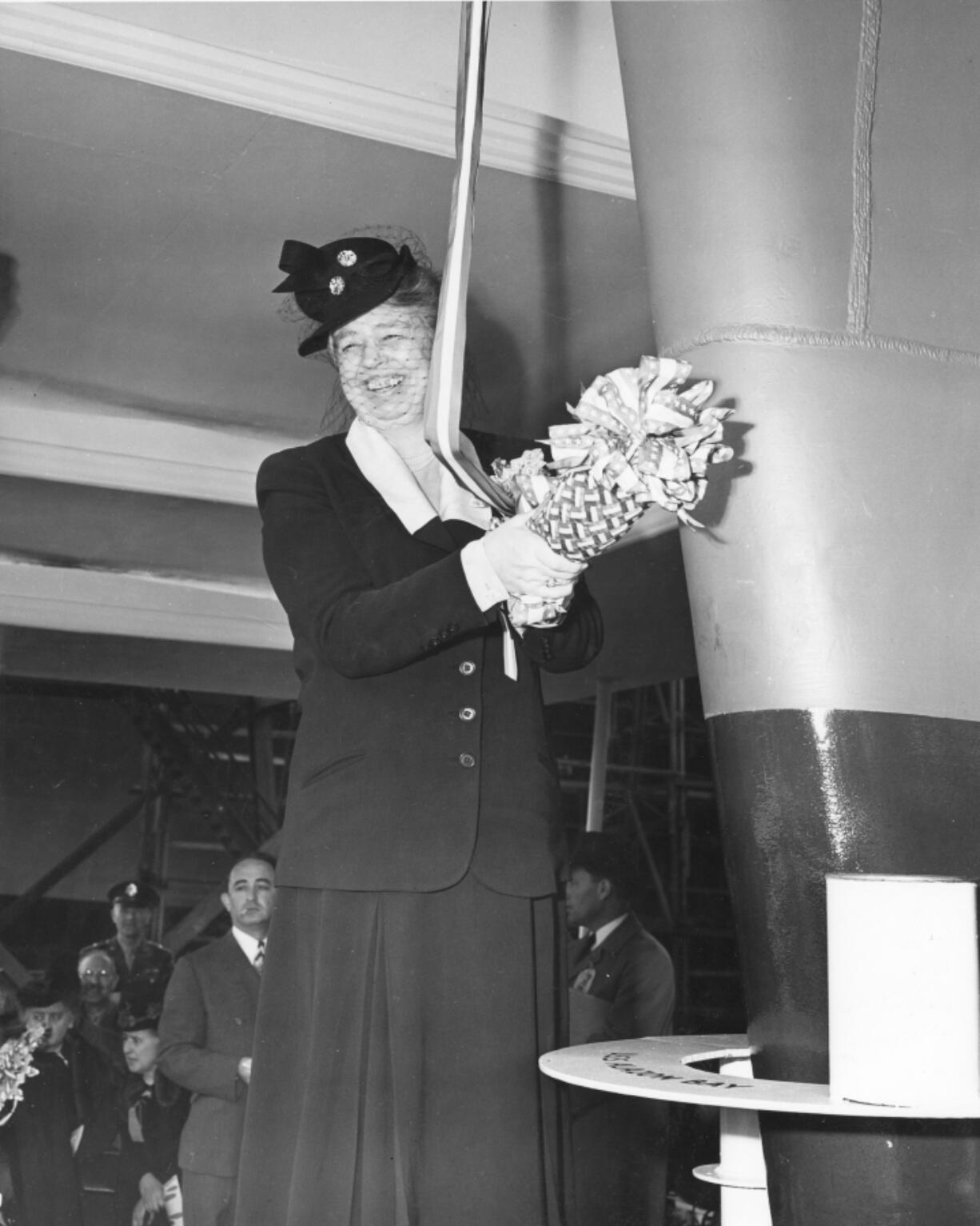 Henry Kaiser convinced President Franklin D. Roosevelt that by splitting his production on the East and West Coast he could build 100 baby flattops as escorts for battleships. First Lady Eleanor Roosevelt christens the USS Casablanca on April 5, 1943, before a crowd of 75,000 onlookers. The ship was the first completed and launched at Vancouver shipyard. Later, she was renamed Alazon Bay.