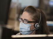 CRESA's Dawn Floyd takes an emergency call while working in downtown Vancouver. During the pandemic, calls have come in for all sorts of things, including people looking for a vaccine. Floyd helps direct them to the right place.