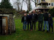 OLD EVERGREEN HIGHWAY: From left is Don Stuart (great grandfather), Paul Cline (grandfather), Jeremy Stuart (father), Tiger, and brothers Ryker and Rogen Stuart, both Star Rank Scouts with Troop 14, at the Jane Weber Evergreen Arboretum.