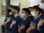 Future Air Force service members - including Georgie Guerrero, third from left - recite the Pledge of Allegiance during the Our Community Salutes ceremony on Saturday at the Fort Vancouver Artillery Barracks. The event honored more than 100 future military service members from throughout the region.