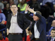 Gonzaga assistant coach Tommy Lloyd, left, alongside head coach Mark Few, has been hired as the new head coach at Arizona, Wednesday, April 14, 2021. The school says Lloyd, a graduate of Kelso High School, will receive a five-year contract, pending approval by the Arizona Board of Regents.