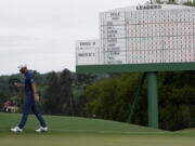 Dustin Johnson walks off the 18th green after his second round in the Masters golf tournament on Friday, April 9, 2021, in Augusta, Ga. (AP Photo/David J.