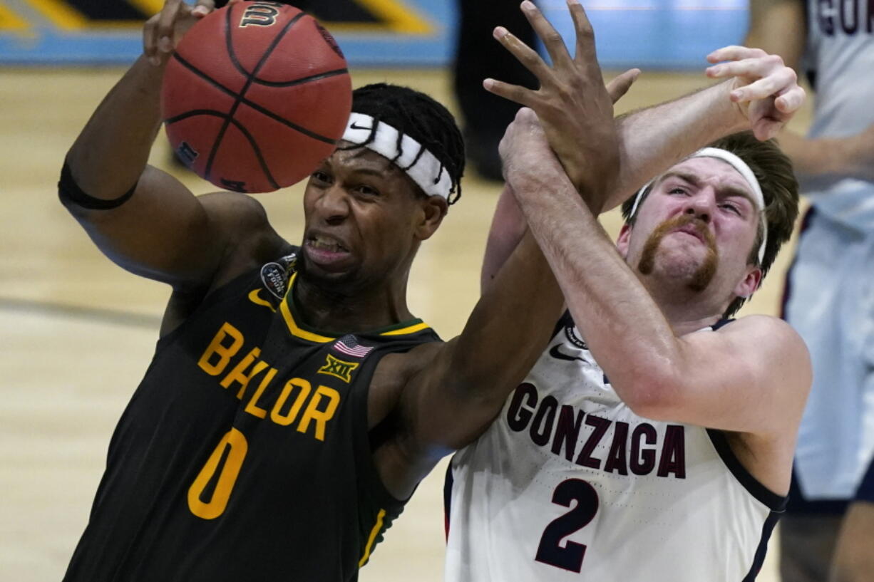 Baylor forward Flo Thamba (0) fights for a rebound with Gonzaga forward Drew Timme (2) during the first half of the championship game in the men&#039;s Final Four NCAA college basketball tournament, Monday, April 5, 2021, at Lucas Oil Stadium in Indianapolis.