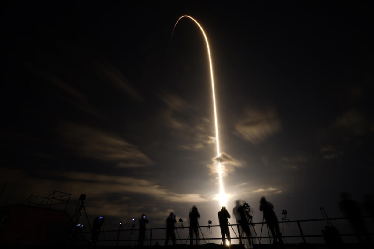 A SpaceX Falcon 9 lifts off in this time exposure from Launch Complex 39A Friday, April 23, 2021, at the Kennedy Space Center in Cape Canaveral, Fla. Four astronauts will fly on the SpaceX Crew-2 mission to the International Space Station.