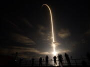 A SpaceX Falcon 9 lifts off in this time exposure from Launch Complex 39A Friday, April 23, 2021, at the Kennedy Space Center in Cape Canaveral, Fla. Four astronauts will fly on the SpaceX Crew-2 mission to the International Space Station.