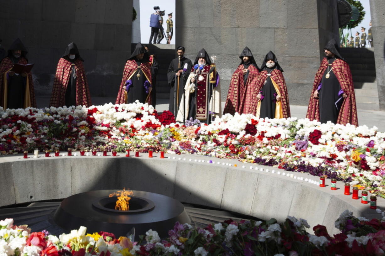 Armenian Apostolic Church leader Catholicos Garegin II, center, attends a memorial service at the monument to the victims of mass killings by Ottoman Turks, to commemorate the 106th anniversary of the massacre, in Yerevan, Armenia, Saturday, April 24, 2021. Armenians marked the anniversary of the death of up to 1.5 million Armenians by Ottoman Turks, an event widely viewed by scholars as genocide, though Turkey refutes the claim.