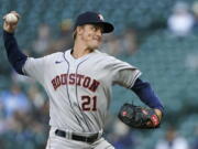 Houston Astros starting pitcher Zack Greinke throws to a Seattle Mariners batter during the first inning of a baseball game Saturday, April 17, 2021, in Seattle. (AP Photo/Ted S.